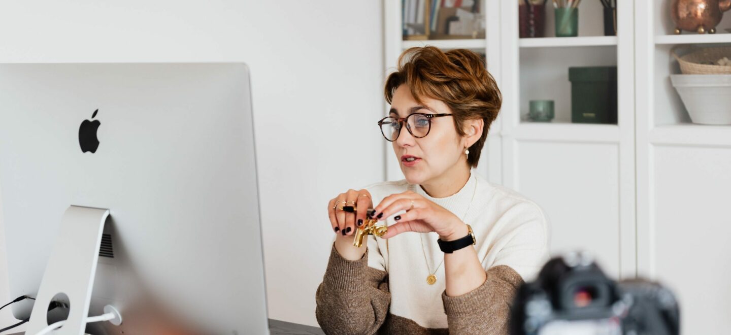 lady at desk looking at computer